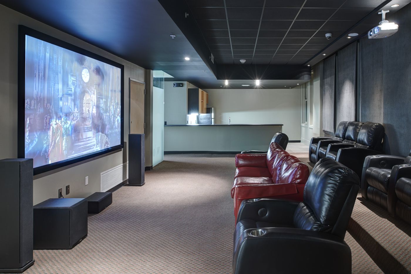 Private theater room with leather recliners at The Fleming Building