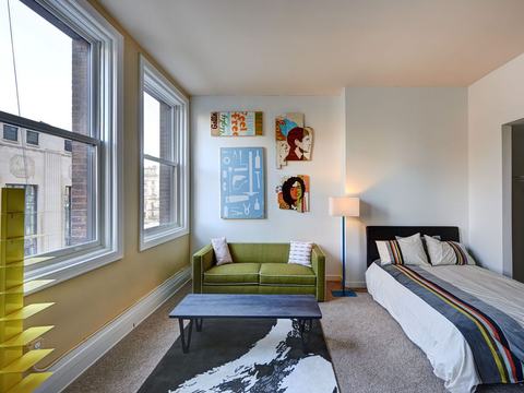 Bedroom with tall windows and closet